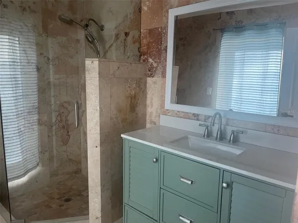 a bathroom with a sink and a mirror