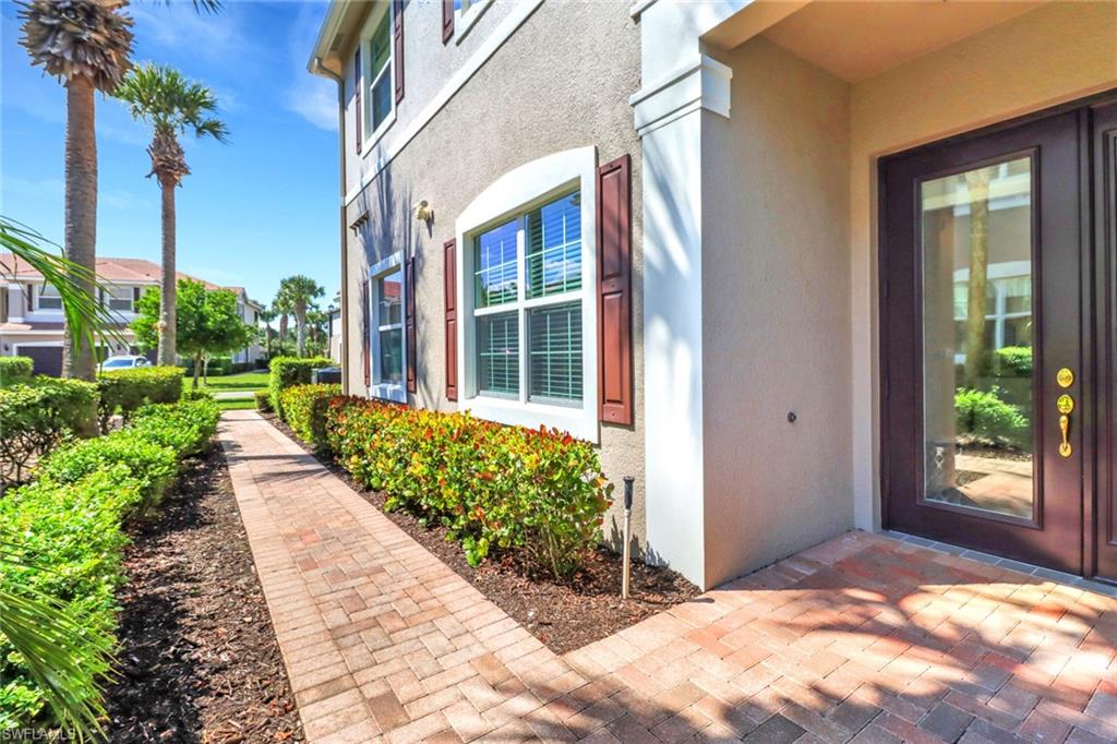 6549 Monterey Point, Unit 104 Naples, FL 34105 - Photo 2 of 34 RESIDENCE HAS SIDE ENTRY AND PRIVATE WALKWAY