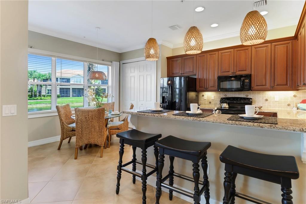 6549 Monterey Point, Unit 104 Naples, FL 34105 - Photo 10 of 34 KITCHEN BAR