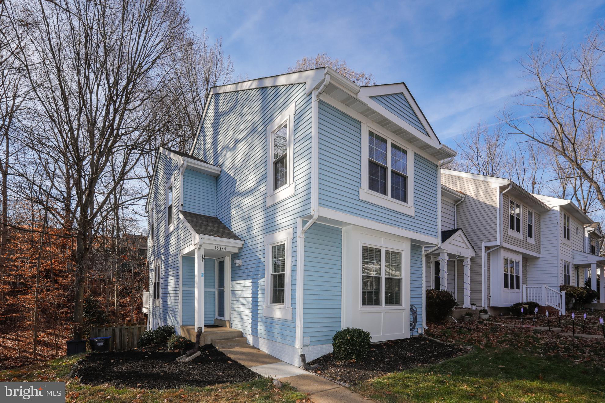 15334 Inlet Place Dumfries, VA 22025 - Photo 2 of 32 a front view of a house with a yard