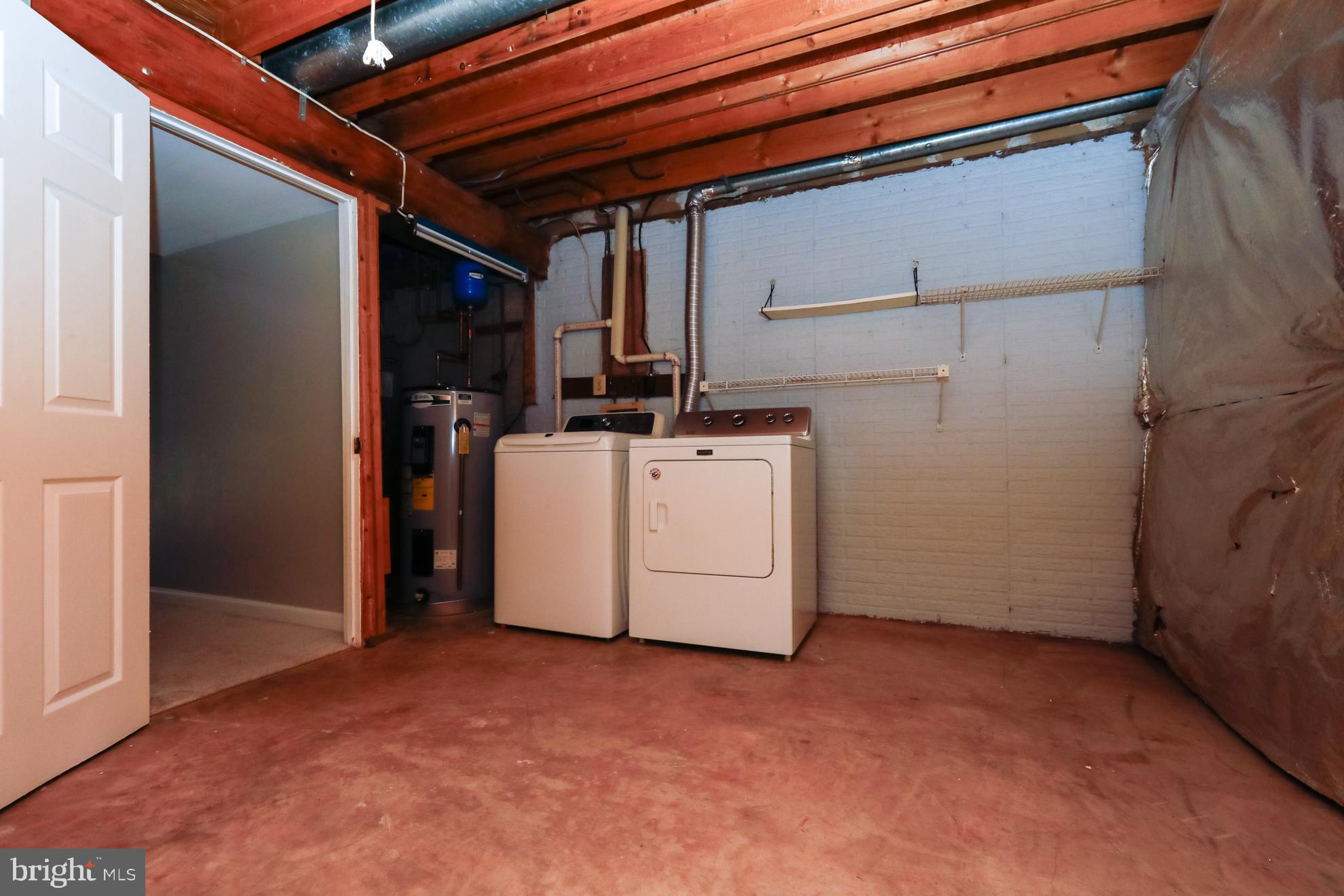 15334 Inlet Place Dumfries, VA 22025 - Photo 21 of 32 a view of a storage & utility room with washer and dryer