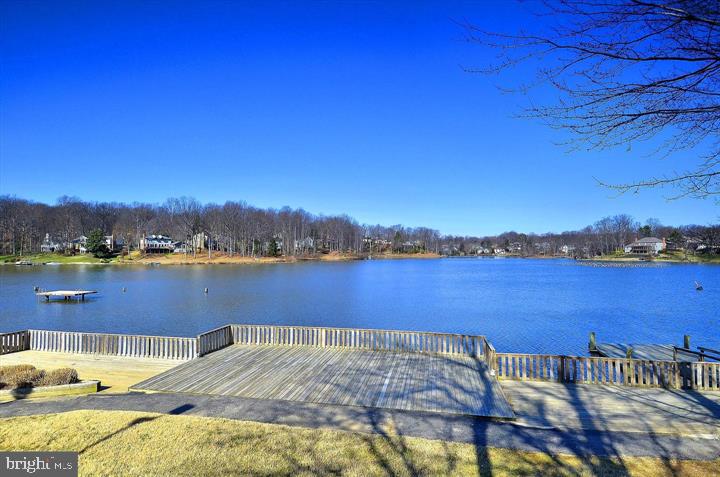 15334 Inlet Place Dumfries, VA 22025 - Photo 28 of 32 a view of a lake with houses in the background
