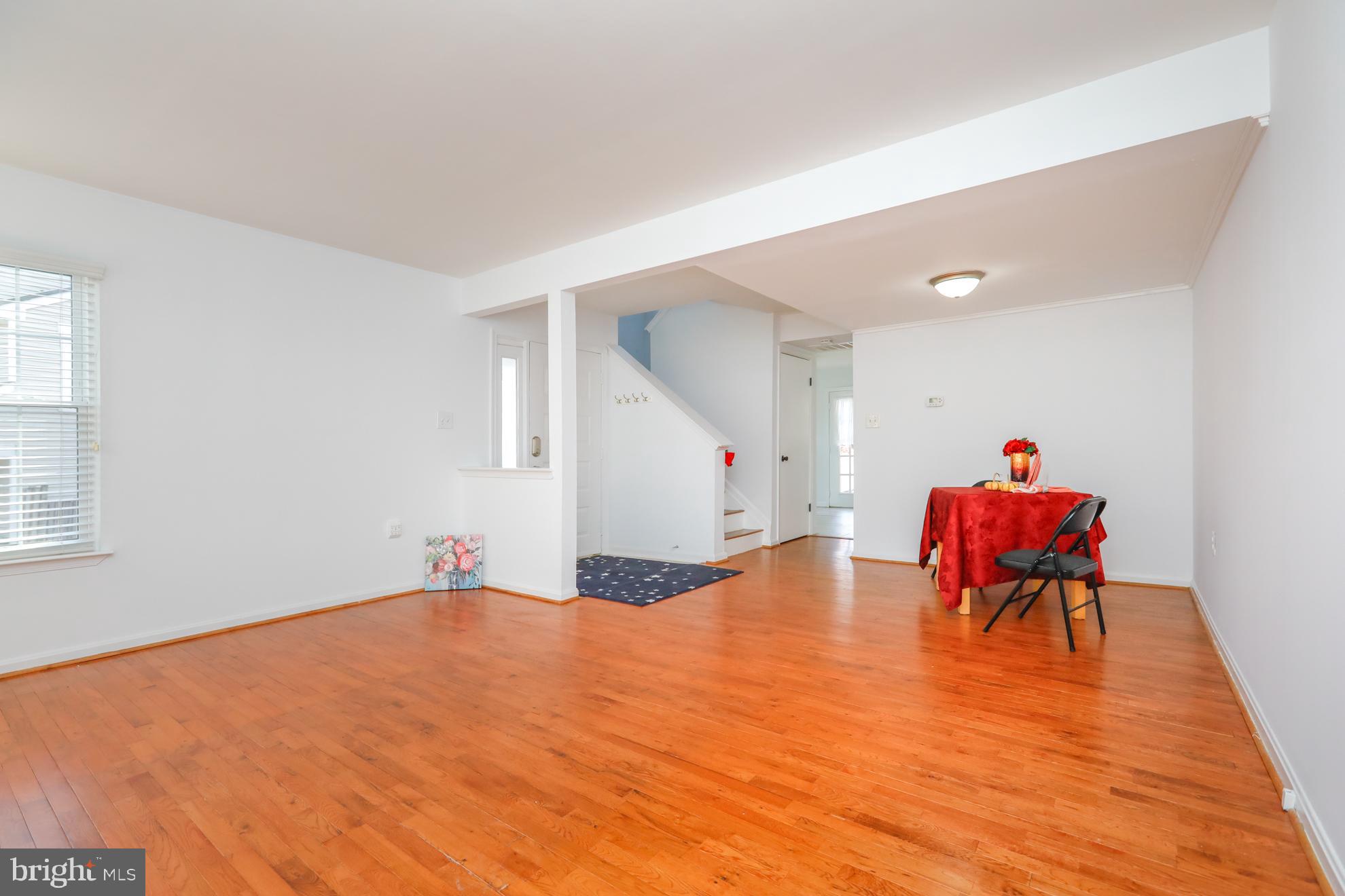 15334 Inlet Place Dumfries, VA 22025 - Photo 4 of 32 a room with furniture and a wooden floor