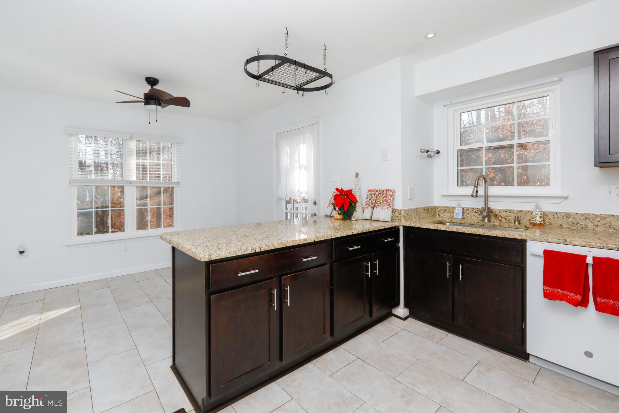 15334 Inlet Place Dumfries, VA 22025 - Photo 7 of 32 a kitchen with a sink and cabinets