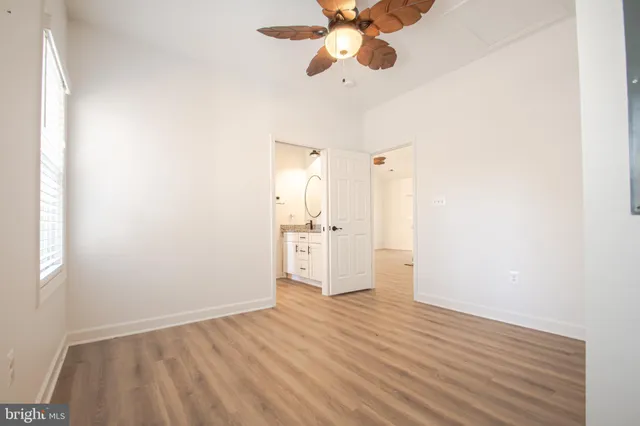 a white toilet sitting next to a shower curtain