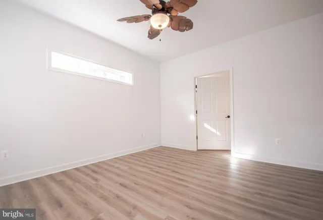 a white toilet sitting next to a shower