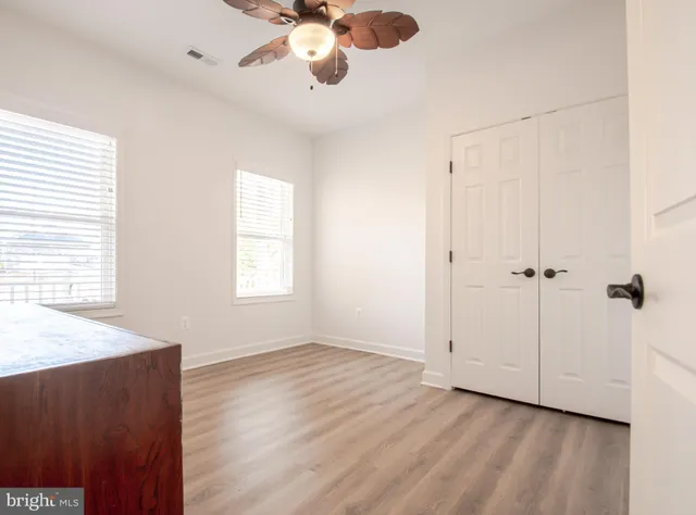 an empty room with wooden floor