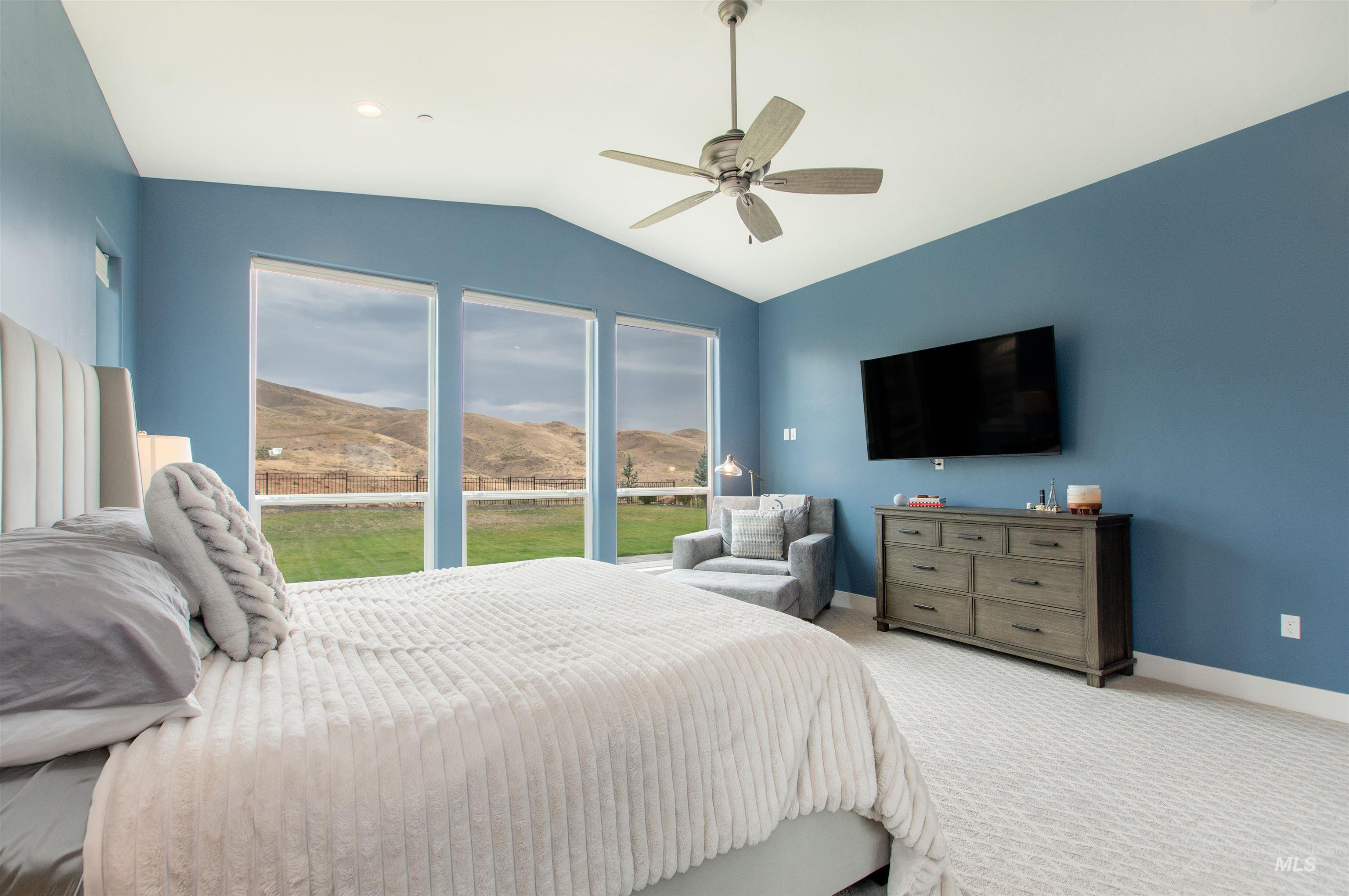 2400 South Trapper Place Boise, ID 83716 - Photo 16 of 50 Carpeted bedroom featuring vaulted ceiling and ceiling fan