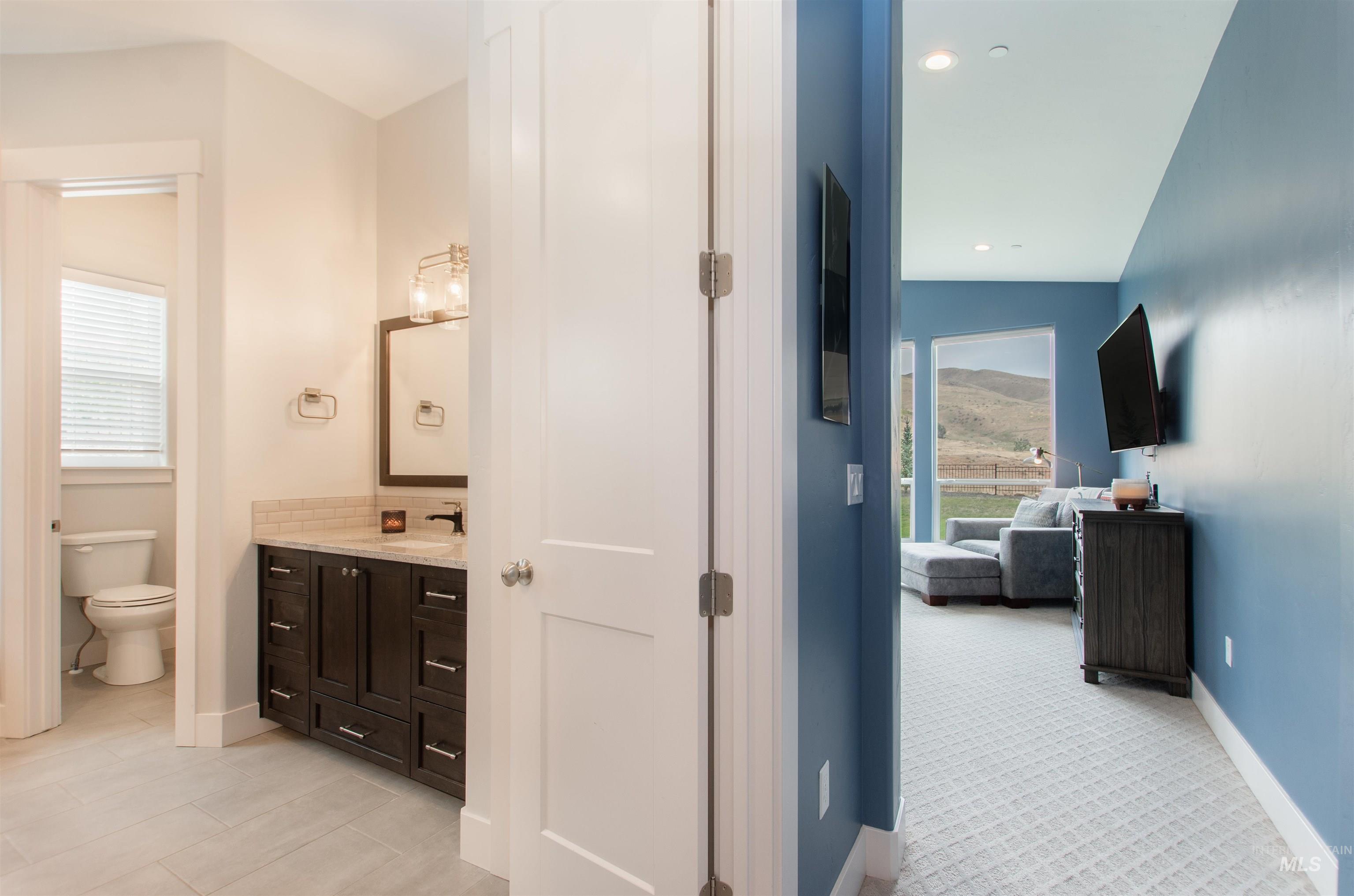 2400 South Trapper Place Boise, ID 83716 - Photo 17 of 50 Bathroom with vanity, ensuite bath, and recessed lighting