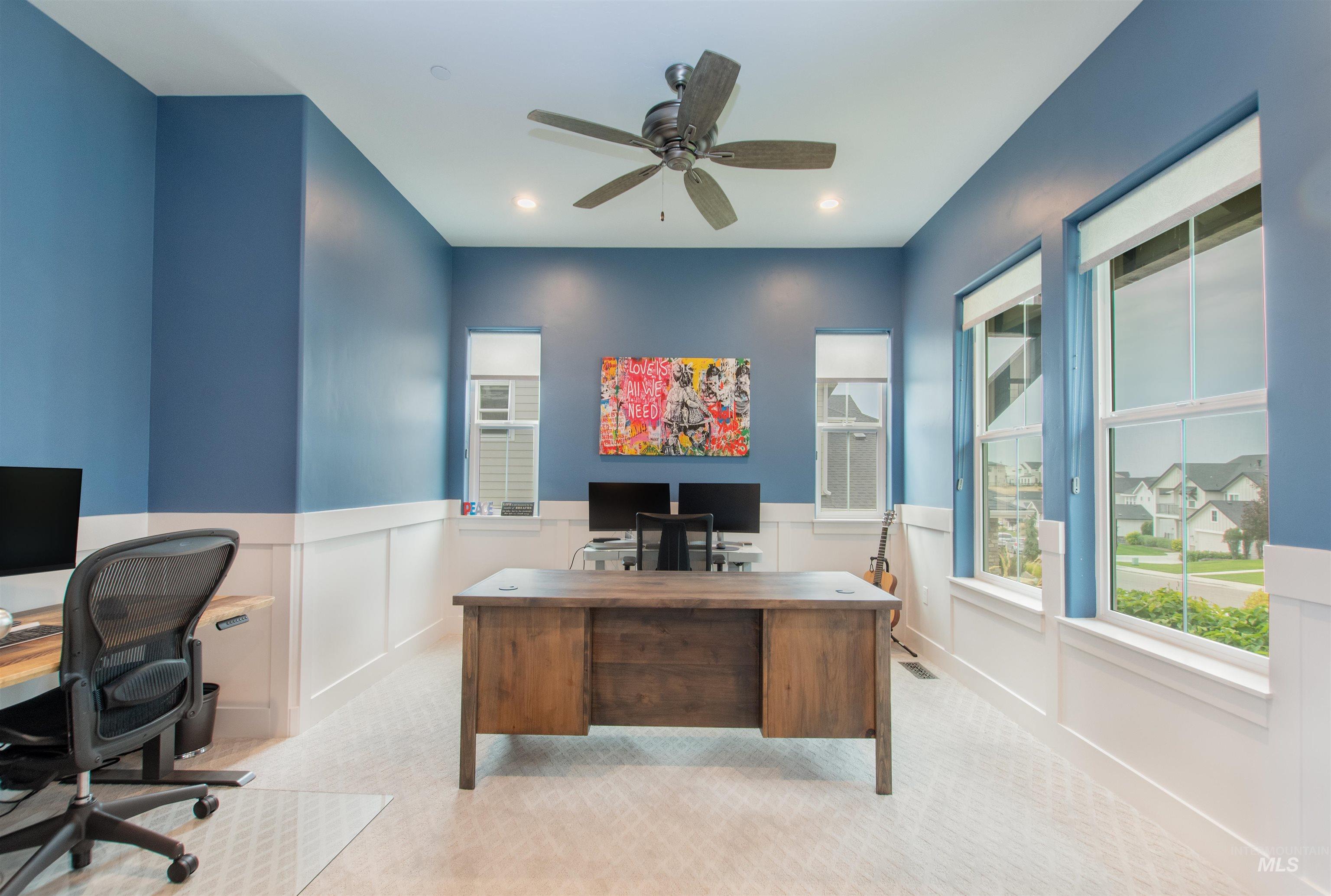 2400 South Trapper Place Boise, ID 83716 - Photo 20 of 50 Carpeted home office featuring a ceiling fan, recessed lighting, wainscoting, and a decorative wall