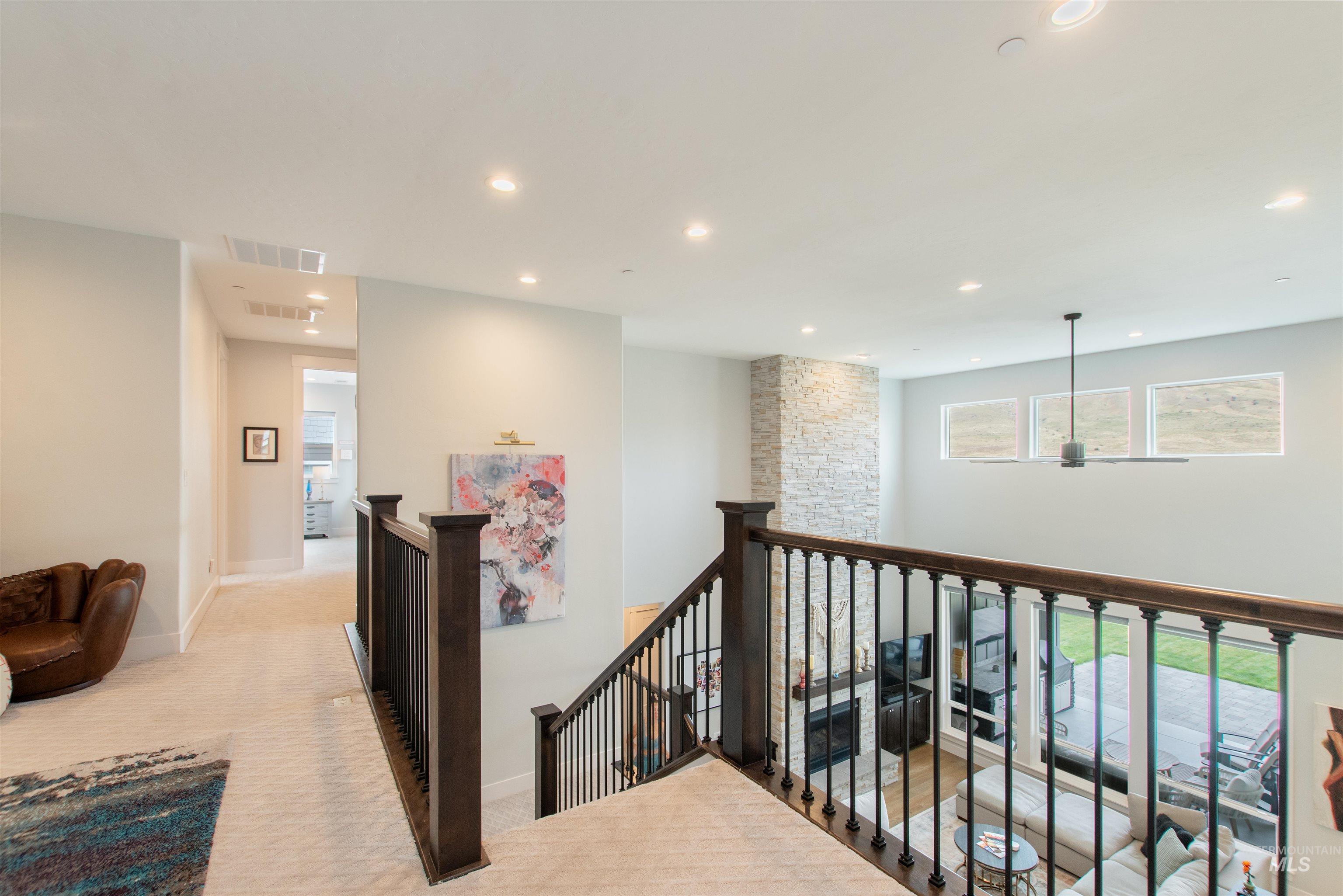 2400 South Trapper Place Boise, ID 83716 - Photo 22 of 50 Corridor featuring an upstairs landing, recessed lighting, and light carpet