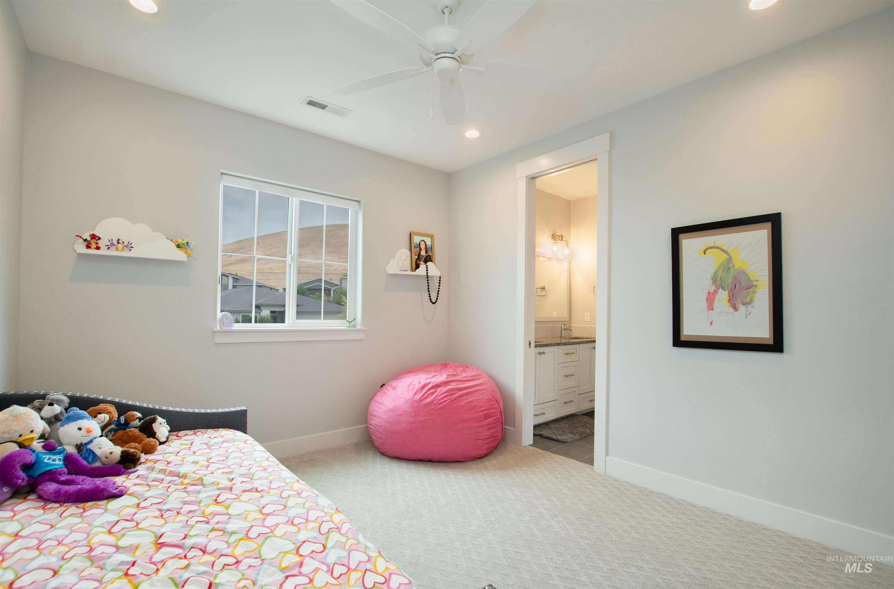 2400 South Trapper Place Boise, ID 83716 - Photo 35 of 50 Bedroom with light carpet, recessed lighting, a ceiling fan, and connected bathroom