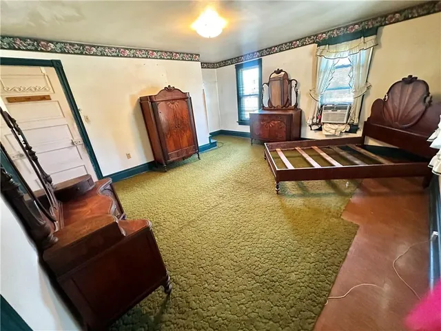 a living room with a bed