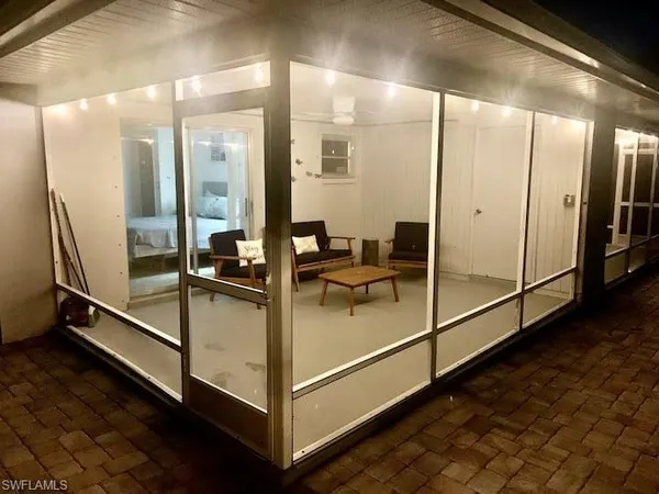 a bathroom with a glass shower door