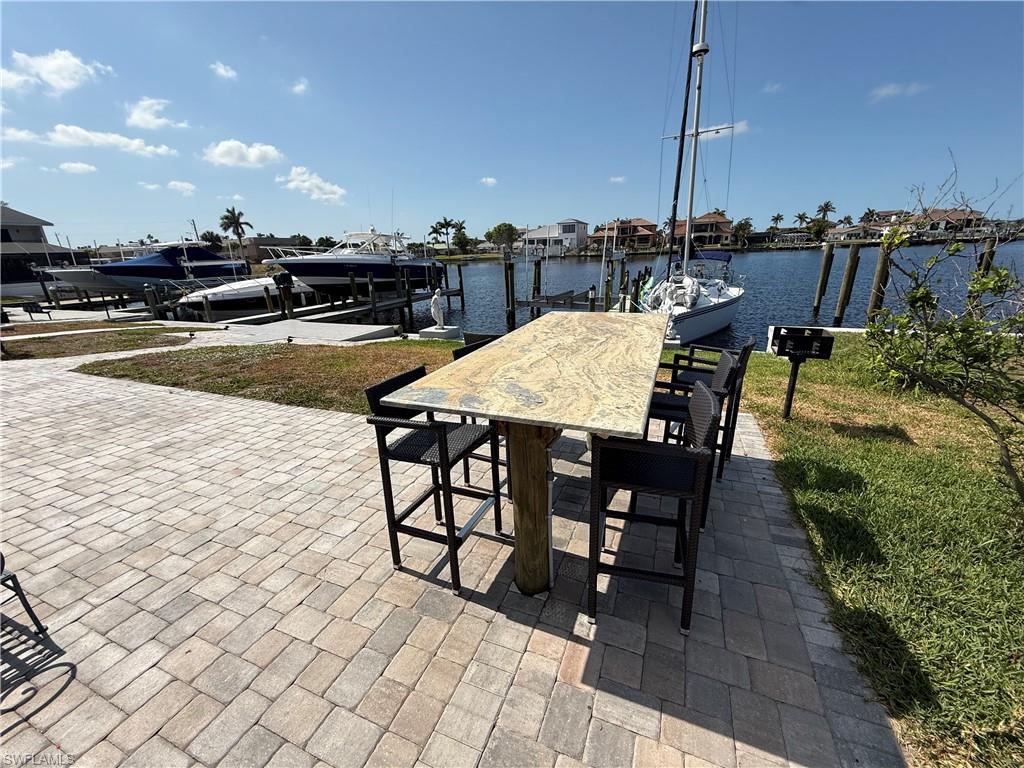 1726 Bikini Court, Unit R Cape Coral, FL 33904 - Photo 13 of 14 a view of an outdoor space with furniture