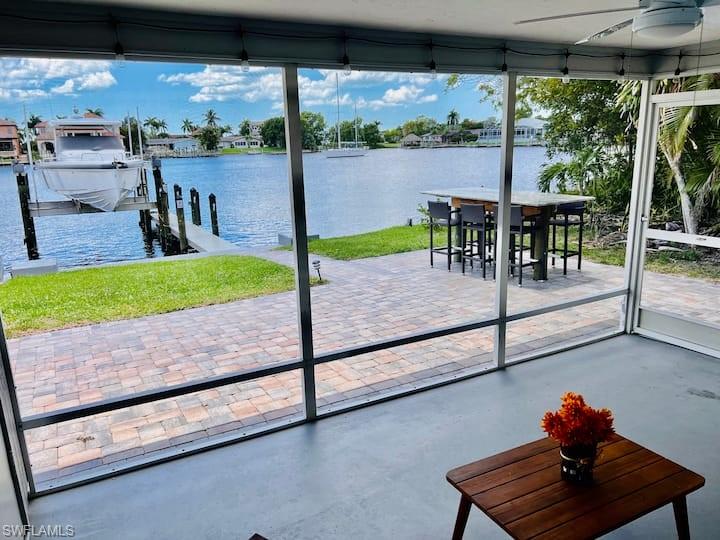 1726 Bikini Court, Unit R Cape Coral, FL 33904 - Photo 2 of 14 a view of a porch and garden