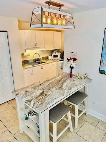 a kitchen with stainless steel appliances granite countertop a sink and stove