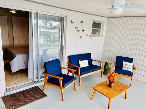 a living room with furniture and a window