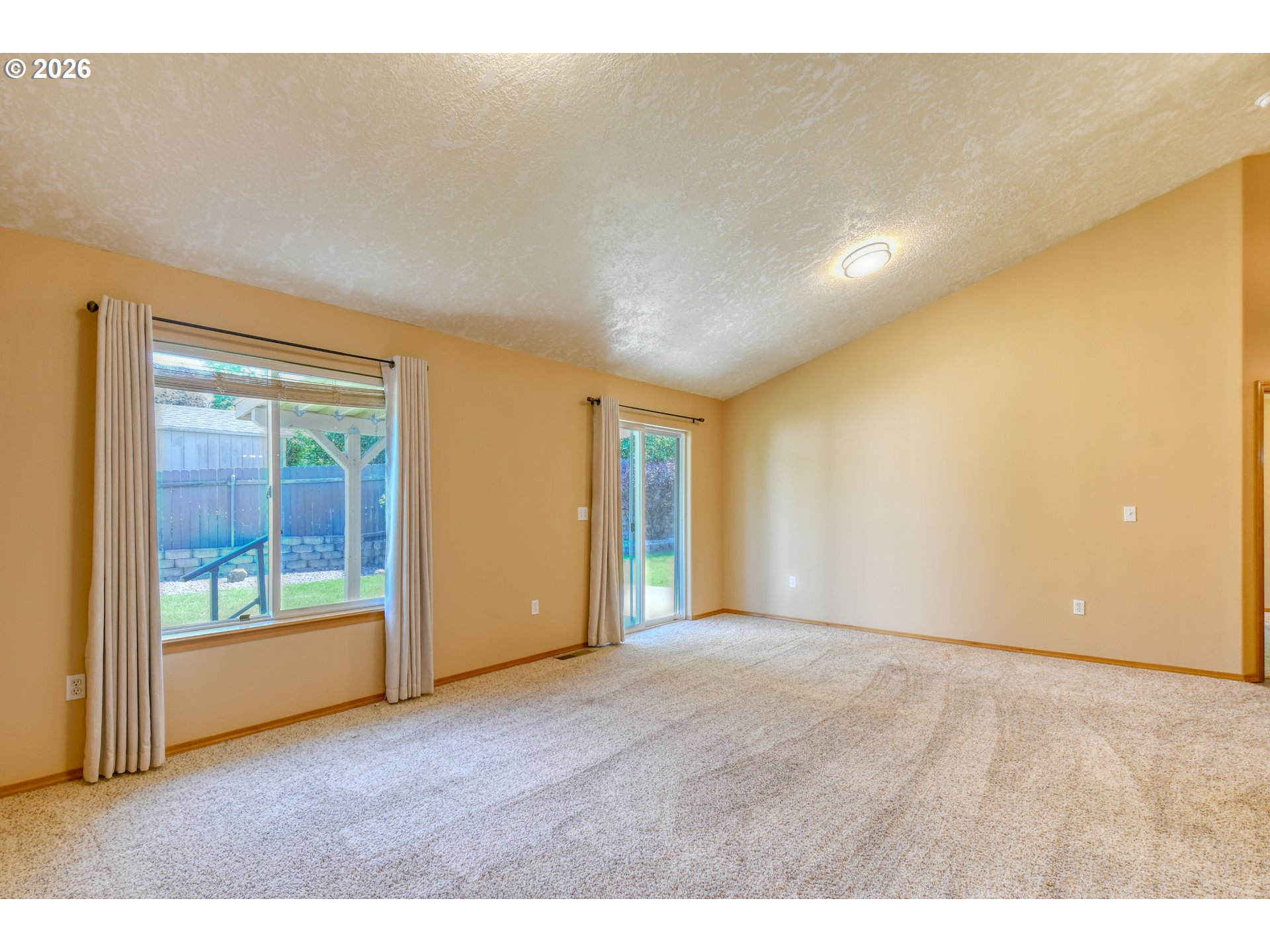 1614 Southwest 3rd Street Pendleton, OR 97801 - Photo 4 of 40 a view of an empty room with wooden floor and a window