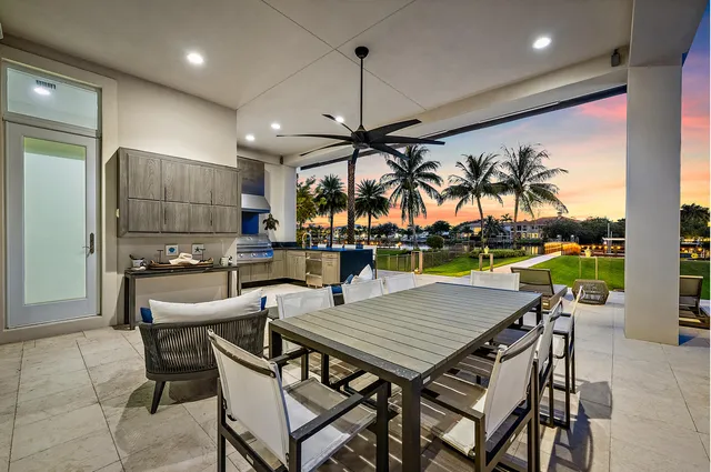 a view of a house with a backyard patio and swimming pool