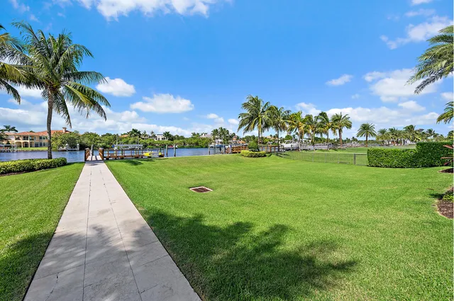 a view of a roof deck with couches and wooden floor