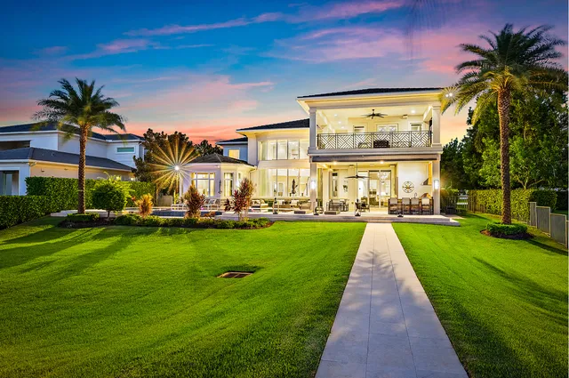 a spacious bedroom with a bed and a large window