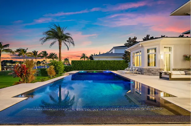 a bathroom with a granite countertop sink mirror and shower