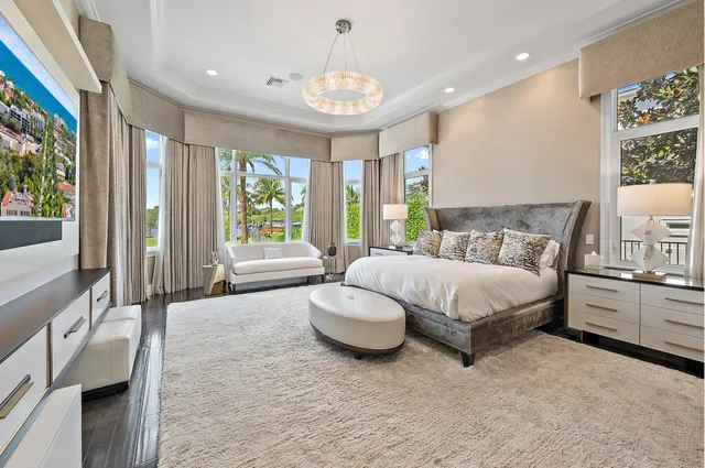 a bathroom with a granite countertop toilet a sink and a mirror