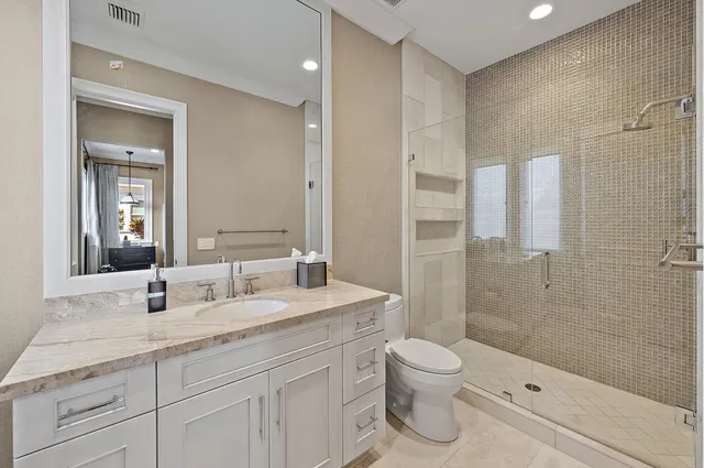 an aerial view of a houses with a swimming pool