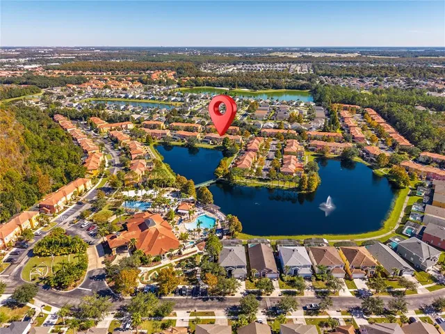 an aerial view of a house with a swimming pool