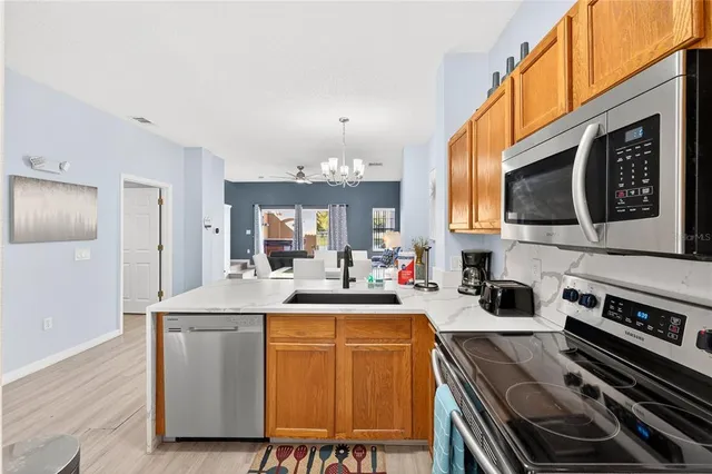 a kitchen with a stove and a microwave