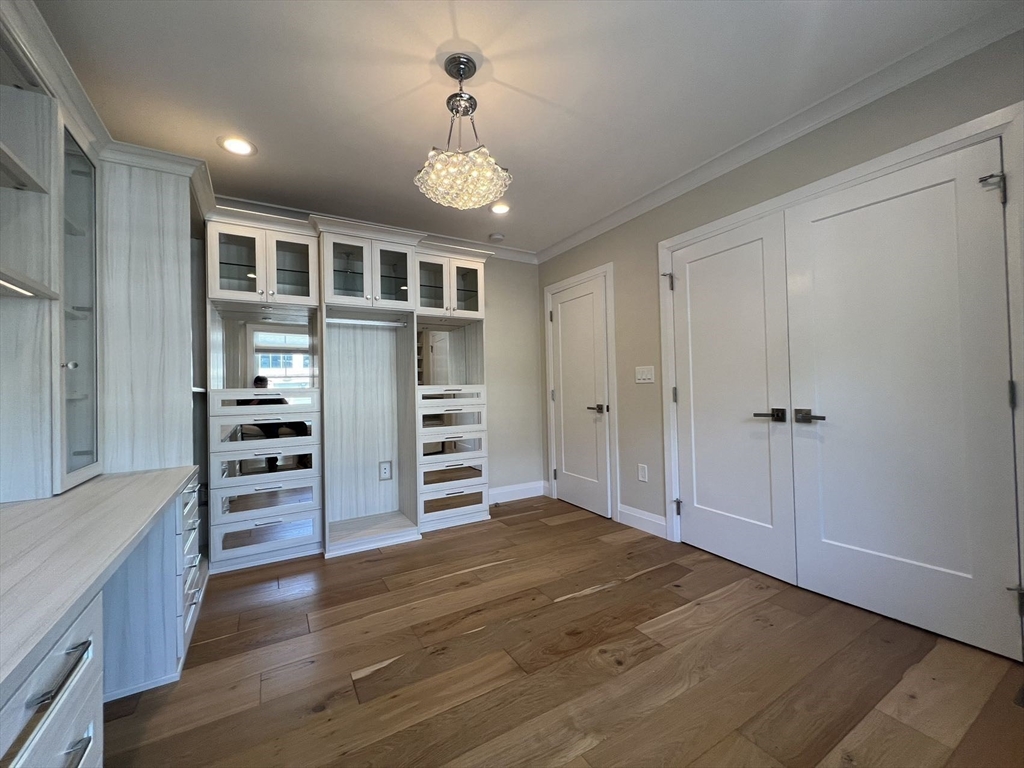 23 Winslow Road, Unit 1 Brookline, MA 02446 - Photo 9 of 27 a view of kitchen with furniture and wooden floor