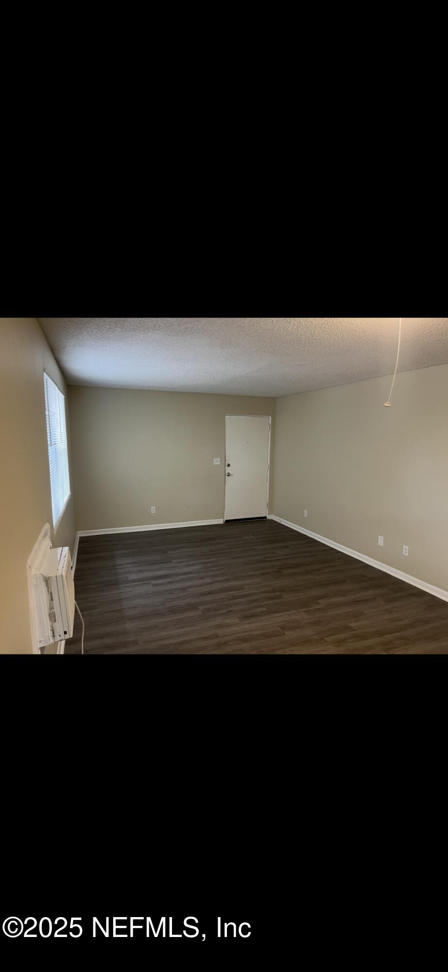 1110 Caliente Drive, Unit 52 Jacksonville, FL 32211 - Photo 5 of 12 a view of room with wooden floor