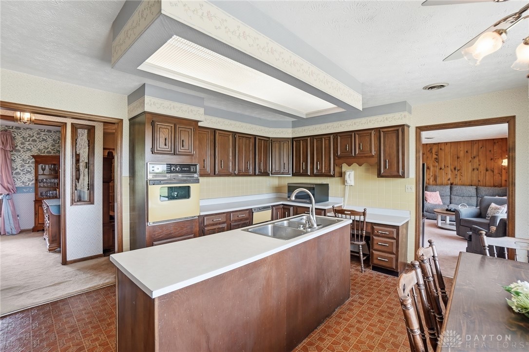 5669 O Neall Road Waynesville, OH 45068 - Photo 25 of 72 This kitchen features a practical layout with ample cabinetry and an integrated island for daily tasks.