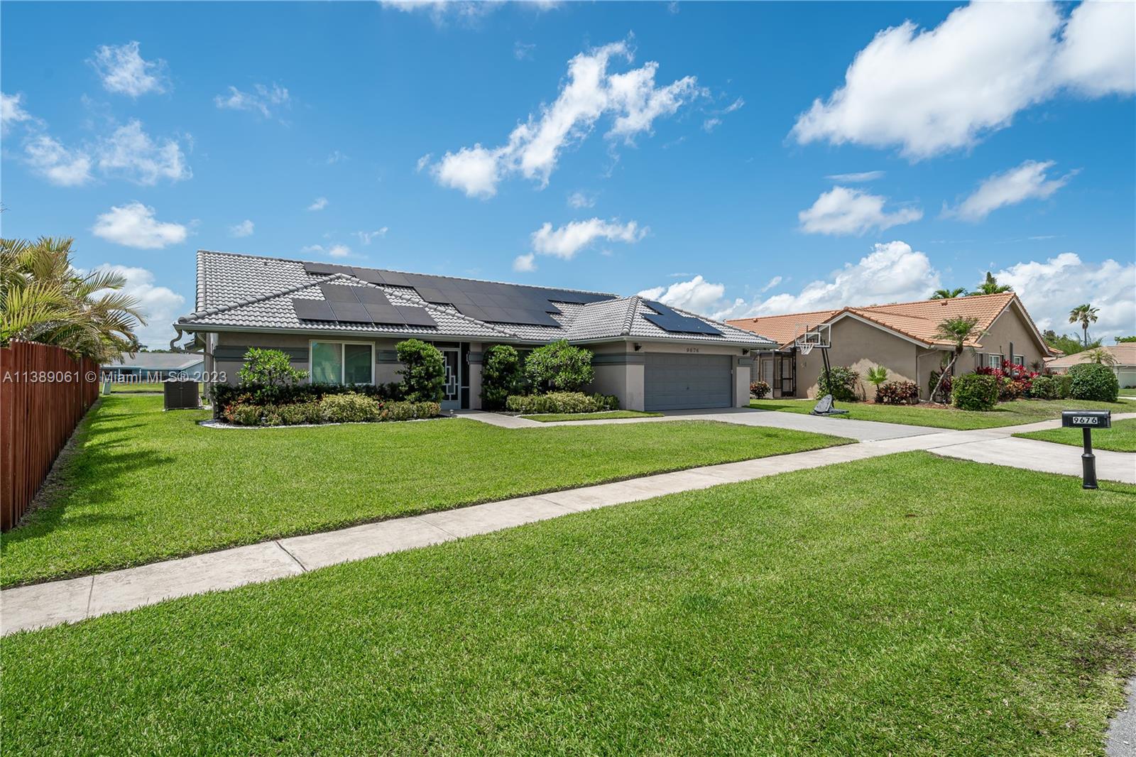 9676 El Clair Ranch Road Boynton Beach, FL 33437 - Photo 31 of 35 a view of house with a big yard