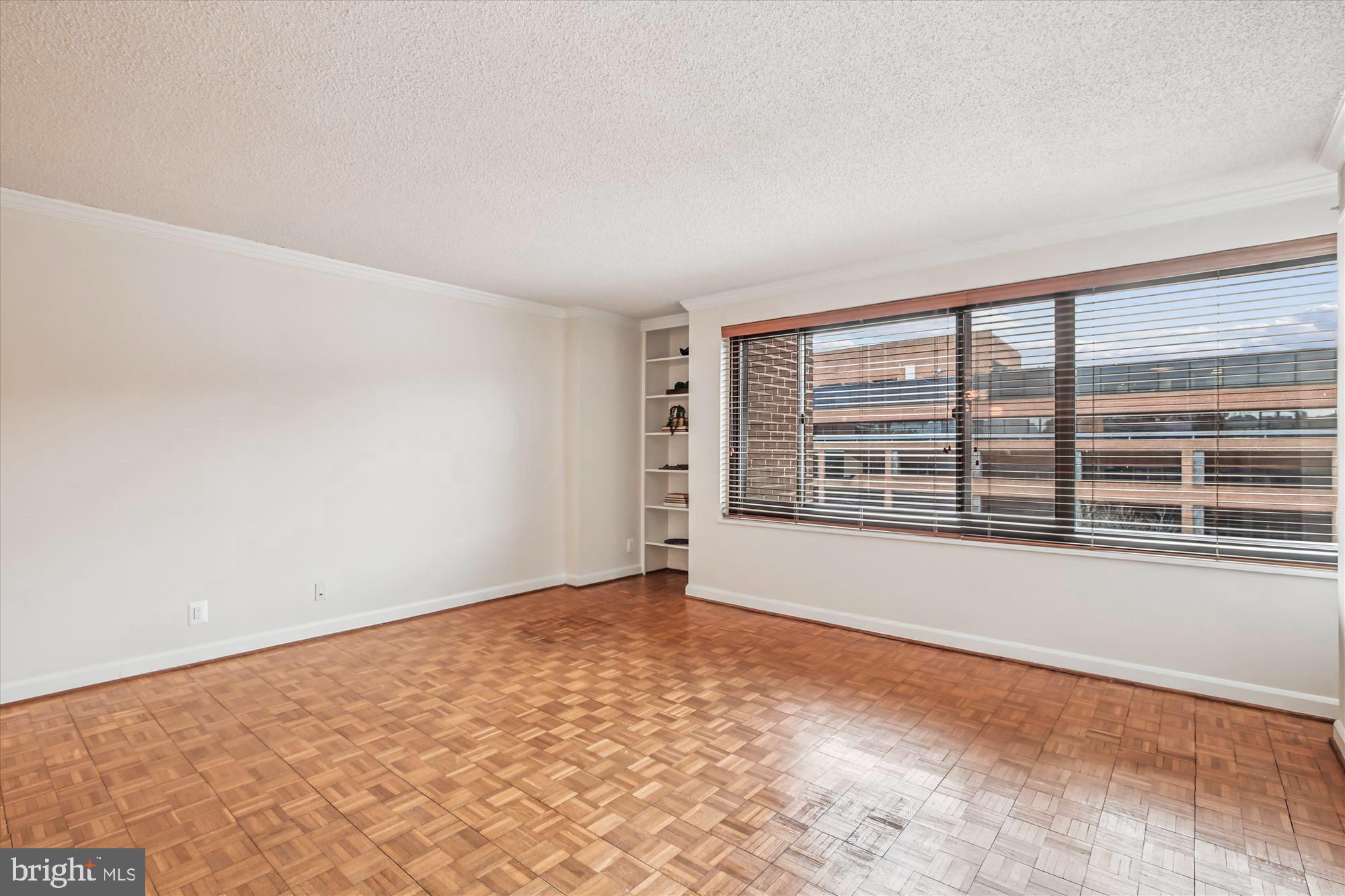 1077 30th Street Northwest, Unit 612 Washington, DC 20007 - Photo 11 of 44 a view of an empty room with a window