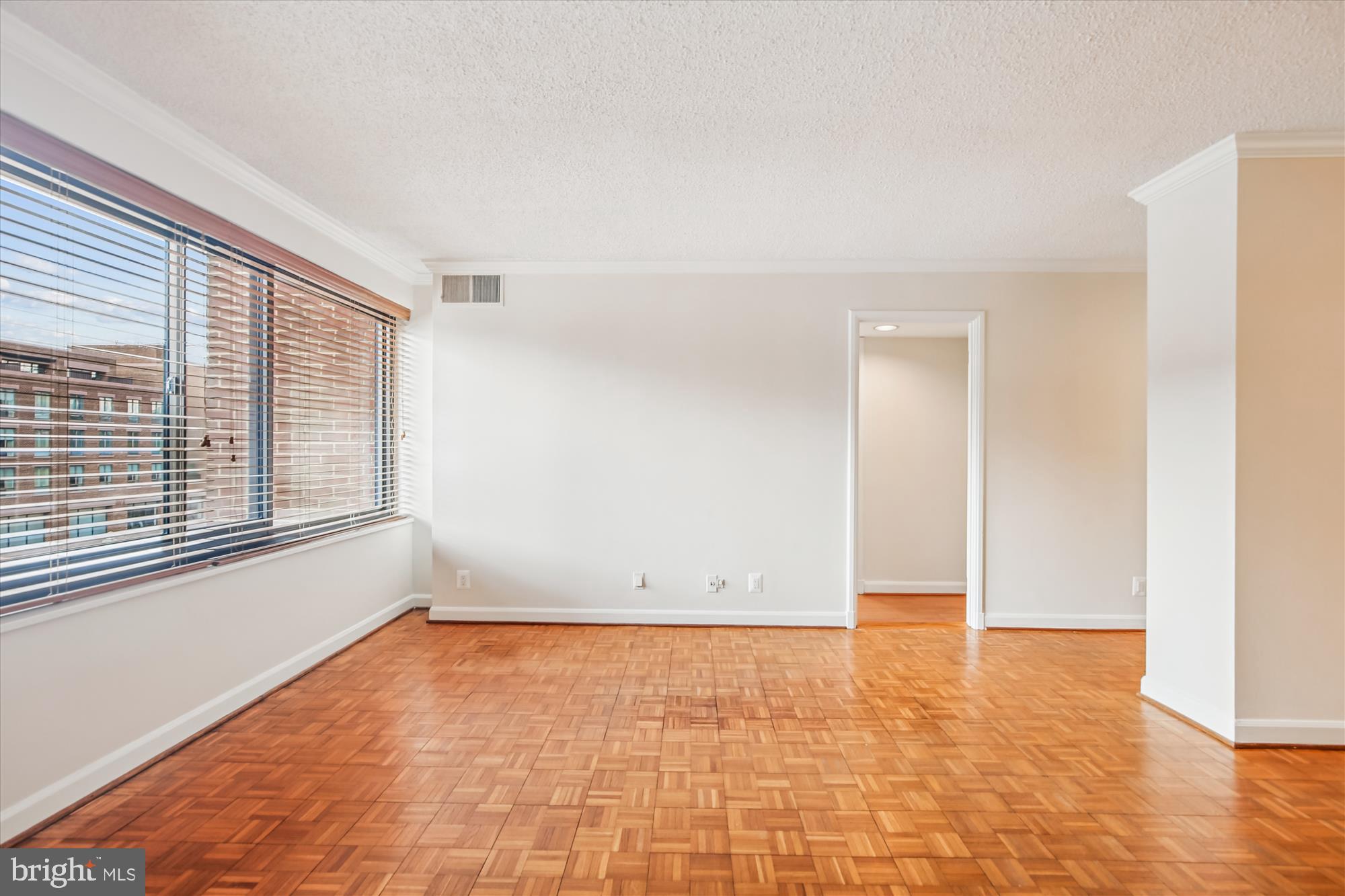 1077 30th Street Northwest, Unit 612 Washington, DC 20007 - Photo 12 of 44 wooden floor in an empty room