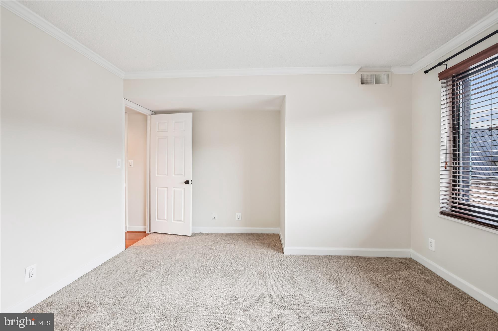 1077 30th Street Northwest, Unit 612 Washington, DC 20007 - Photo 30 of 44 a view of an empty room with a window