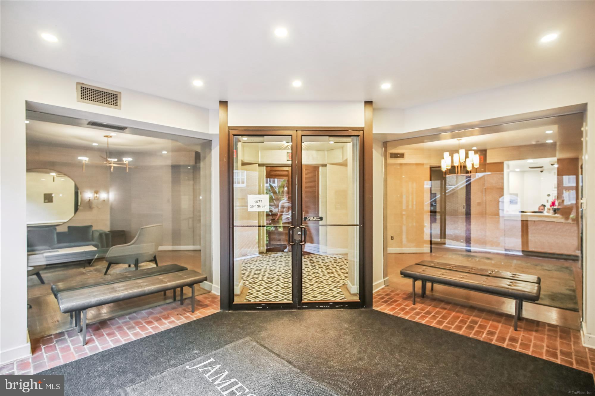 1077 30th Street Northwest, Unit 612 Washington, DC 20007 - Photo 38 of 44 a lobby with furniture and outdoor view