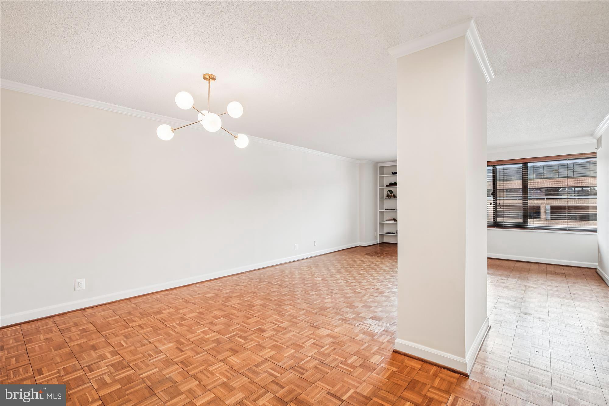 1077 30th Street Northwest, Unit 612 Washington, DC 20007 - Photo 4 of 44 a view of an empty room and window