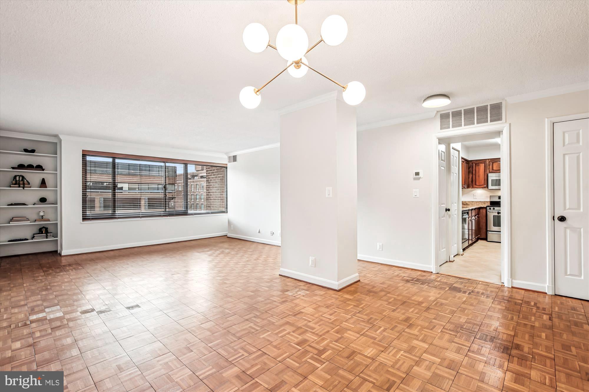 1077 30th Street Northwest, Unit 612 Washington, DC 20007 - Photo 6 of 44 a view of an empty room with a window