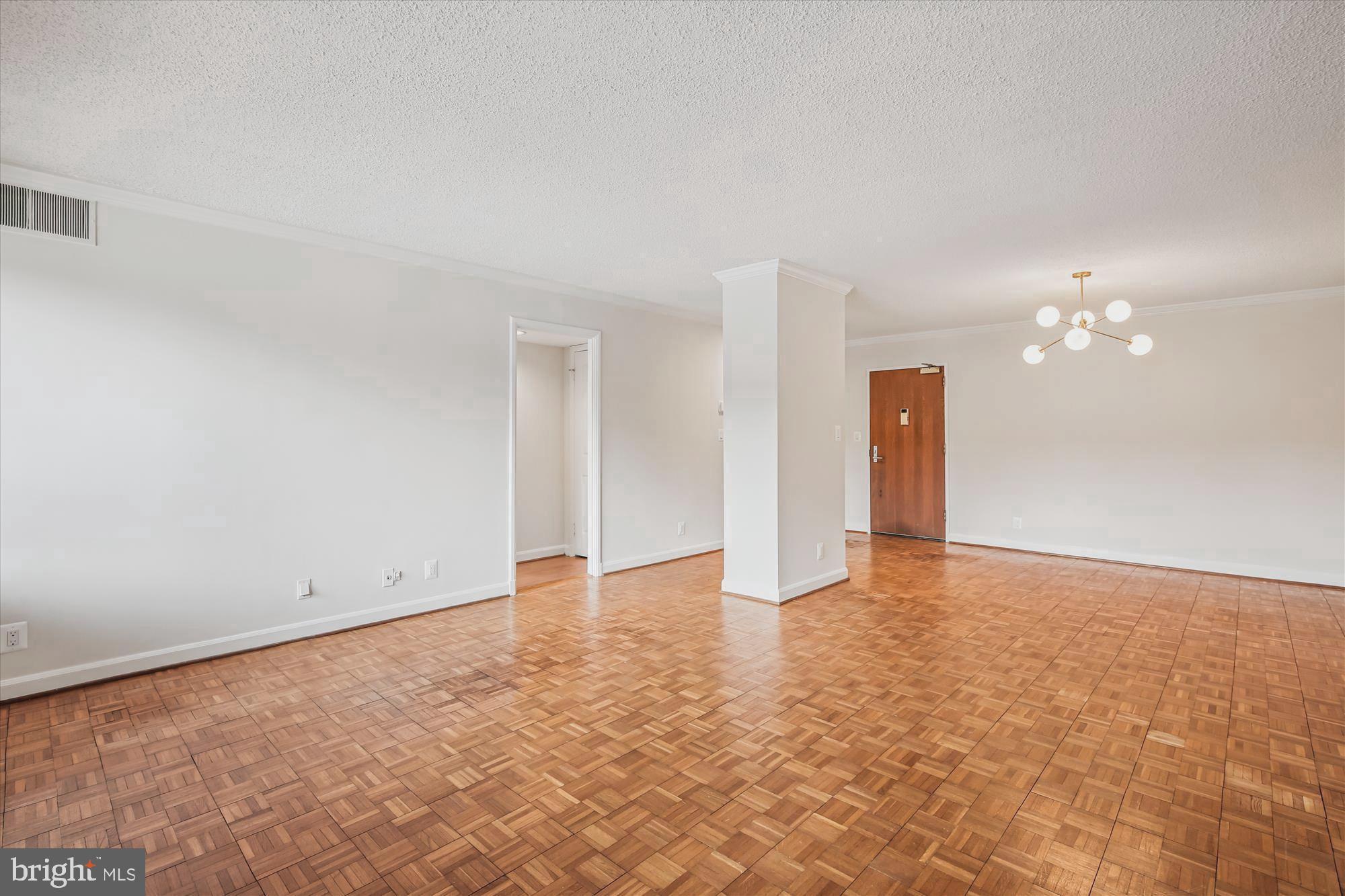 1077 30th Street Northwest, Unit 612 Washington, DC 20007 - Photo 8 of 44 wooden floor in an empty room