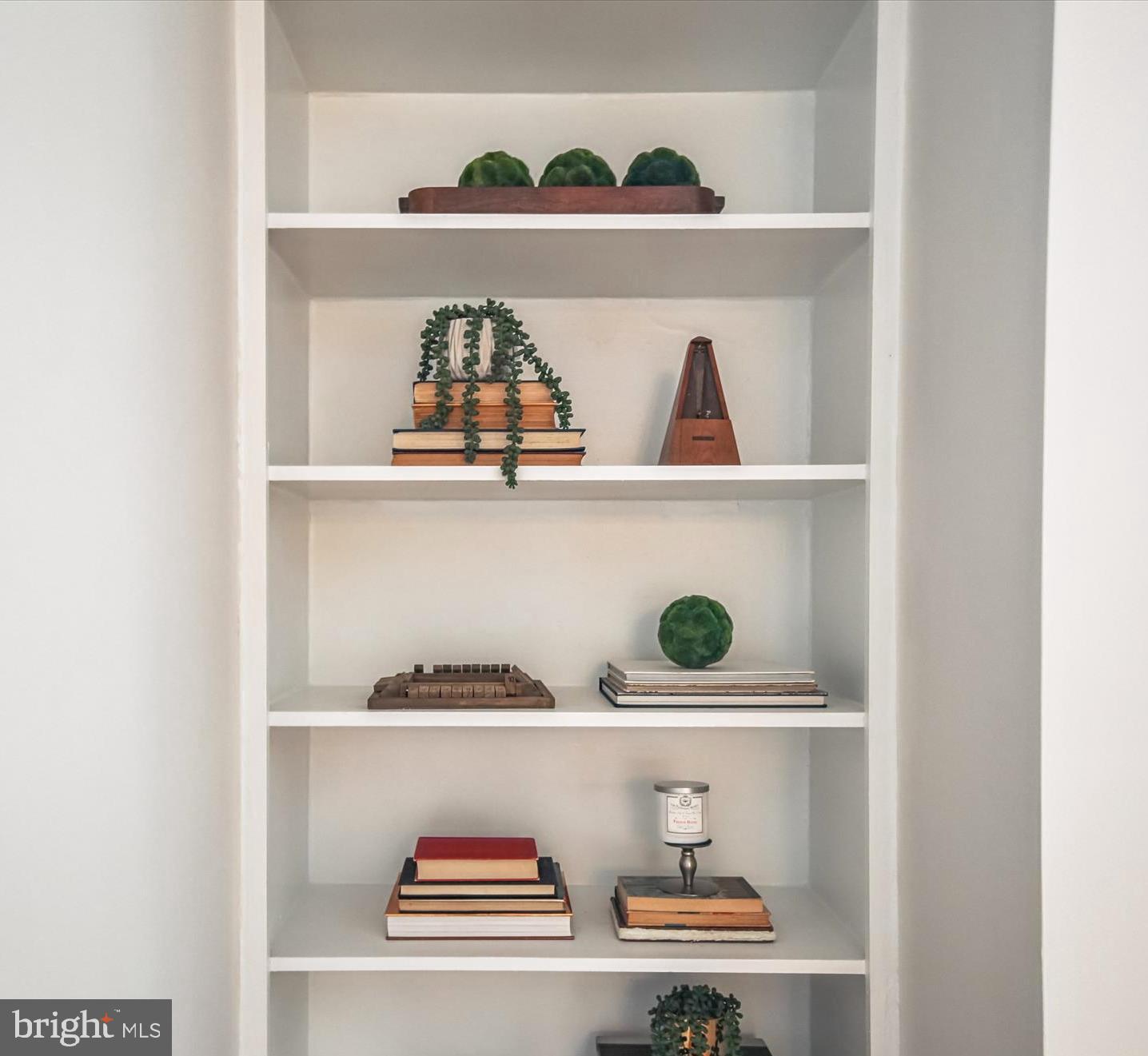 1077 30th Street Northwest, Unit 612 Washington, DC 20007 - Photo 10 of 44 a shelf with cup and plates