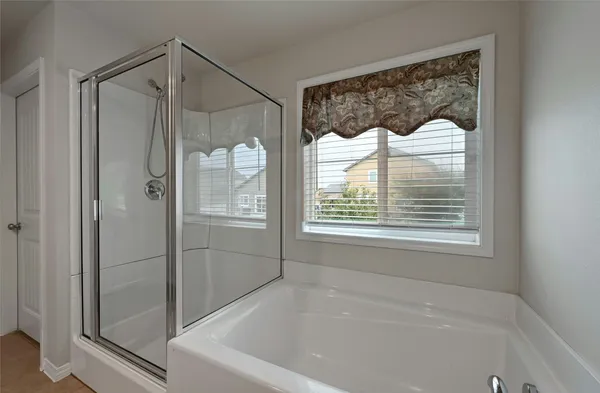 a bathroom with a sink double vanity granite and a mirror