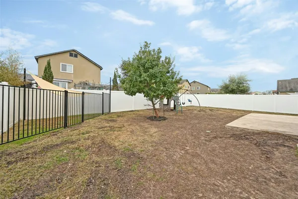 a view of a house with a tree