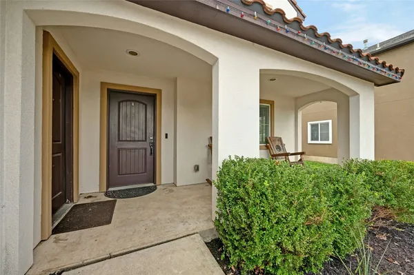 front view of a house with a large window