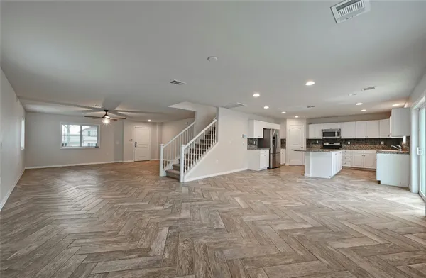 a view of a house with a backyard