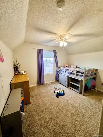 a bedroom with furniture and a chandelier