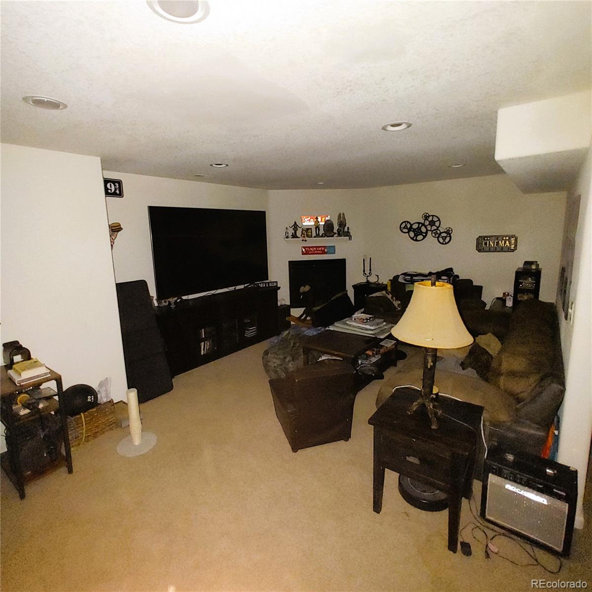 1451 Challenger Drive Pueblo West, CO 81007 - Photo 13 of 26 a living room with furniture and a flat screen tv