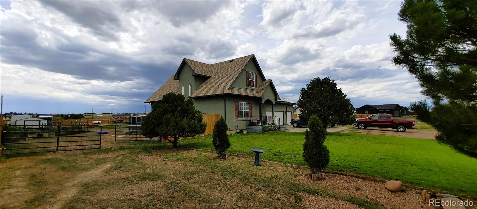1451 Challenger Drive Pueblo West, CO 81007 - Photo 18 of 26 a view of a garden with a house